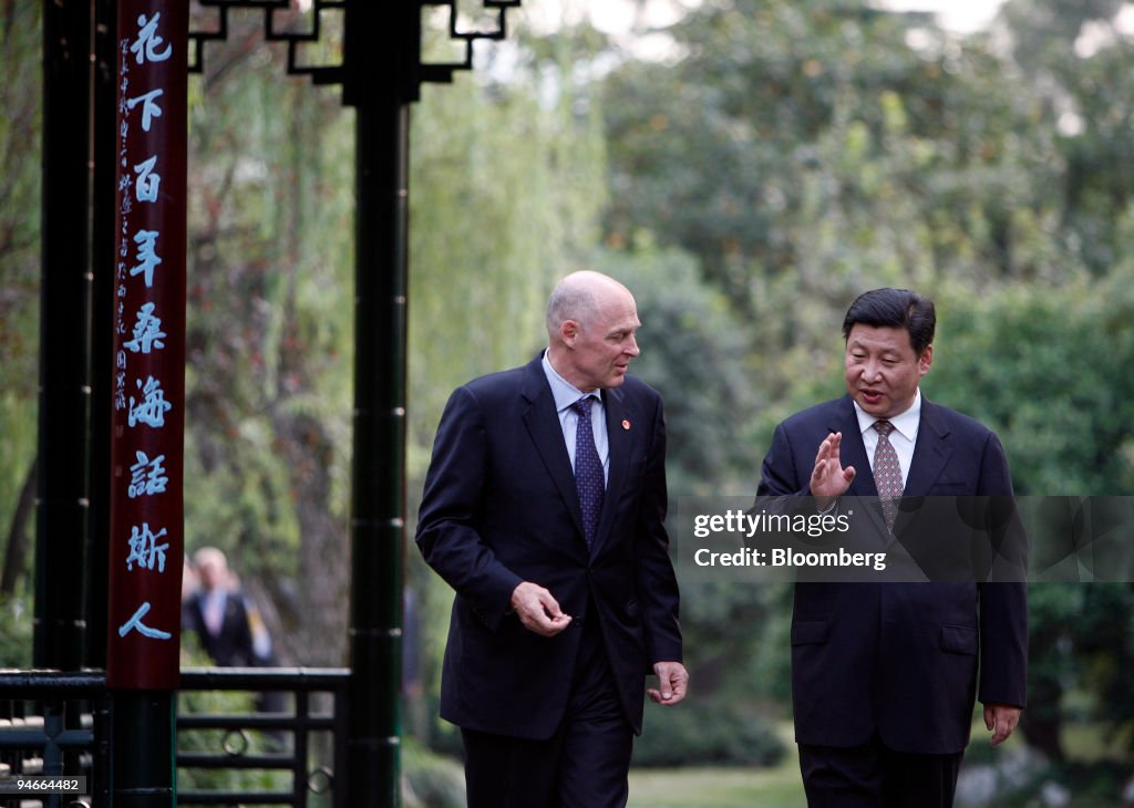 United States Treasury Secretary Henry Paulson, left, talks