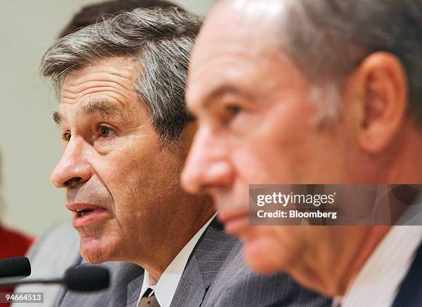 World Bank president Paul Wolfowitz, left, speaks to civil society groups while International Monetary Fund managing director Renato de Rato, right,...