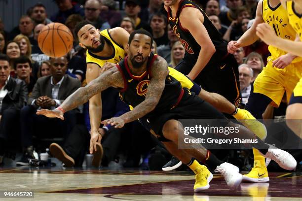 Smith of the Cleveland Cavaliers and Cory Joseph of the Indiana Pacers drive for a ball during the first half in Game One of the Eastern Conference...