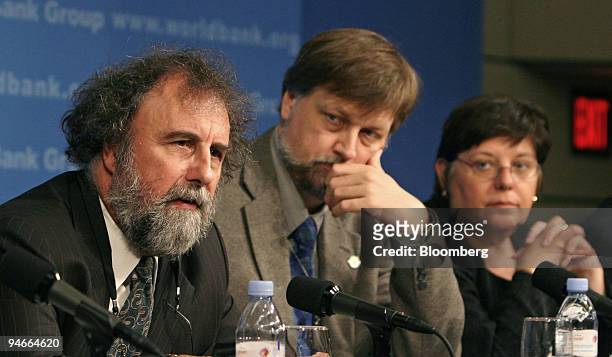 World Bank Chief Scientist Bob Watson, left, speaks during a news conference on the development of clean energy with fellow panelists from the World...