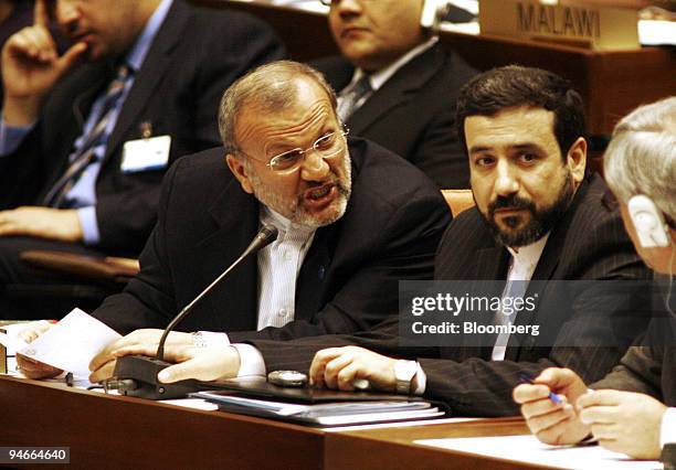 Iran's Foreign Minister Manouchehr Mottaki grimaces while speaking with his aides during the meeting of foreign ministers at the Summit of the...