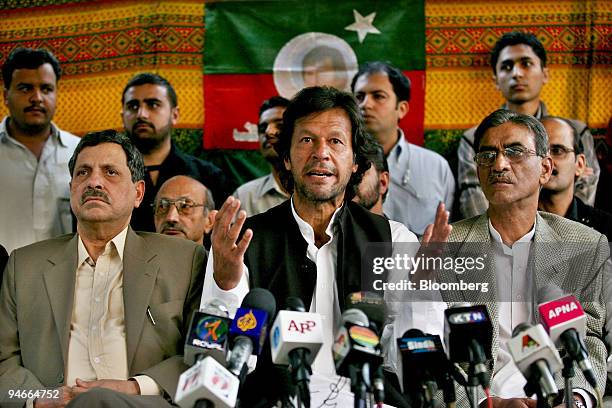 Imran Khan, center, chairman of Pakistan Tehreek-e-Insaf or Movement for Justice, speaks at a press conference in Islamabad, Pakistan, on Thursday,...