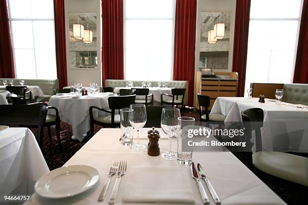 Tables are set ready for the lunch service at Le Cafe Anglais, in west London, U.K., on Thursday, Nov. 22, 2007. Tatler magazine last night named...