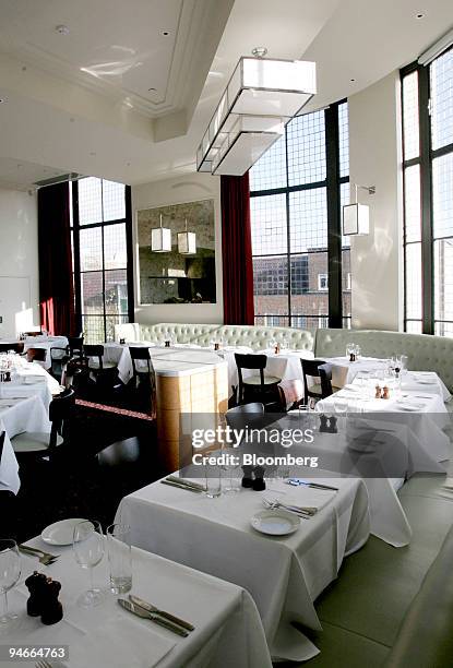 Tables are set ready for the lunch service at Le Cafe Anglais, in west London, U.K., on Thursday, Nov. 22, 2007. Tatler magazine last night named...