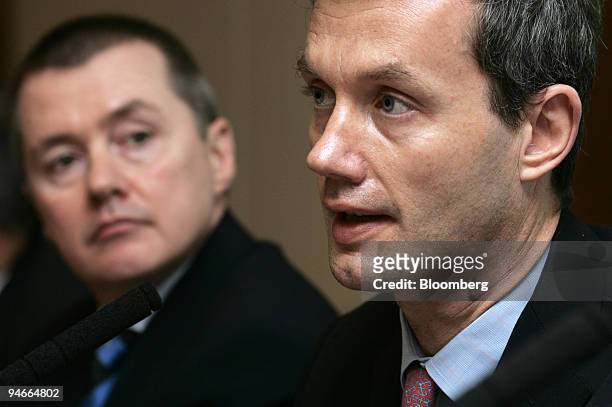 Willie Walsh, left, chief executive officer of British Airways listens to Stephen Nelson, chief executive officer of British Airports Authority at a...
