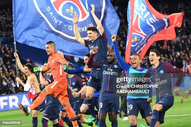 Paris Saint-Germain's players celebrate after winning the French L1 football match between Paris Saint-Germain and Monaco on April 15 at the Parc des...