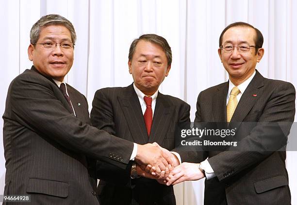 Hiroshi Kimura, president of Japan Tobacco Inc., left, Tetsuji Kanamori, president of Katokichi Co., center, and Koki Ando, president of Nissin Food...