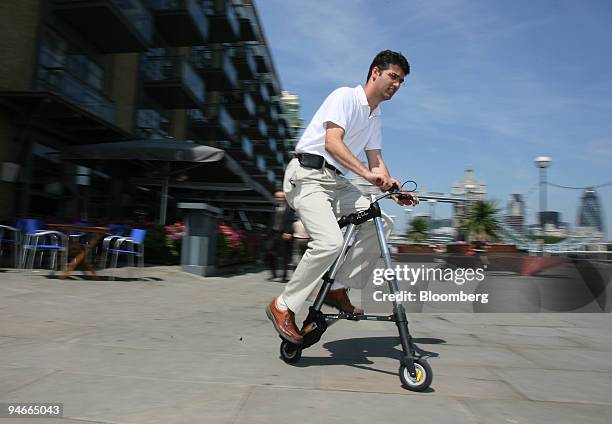 Alex Kalogroulis, the chief design engineer of the A-bike, a new lightweight folding bicycle, demonstrates how to ride it at its launch in London,...