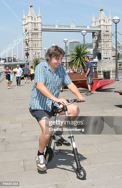 Marc James, of London, test drives the A-bike, a new lightweight folding bicycle which was launched in London, U.K., Wednesday, July 12, 2006. The...