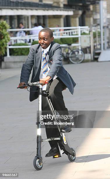 Martin Mwangi of the St. Martin's School in London, test drives the A-bike, a new lightweight folding bicycle which was launched in London, U.K.,...