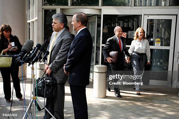 Jeffrey Skilling, former Enron Corp. Executive, front right, and his lead trial counsel Daniel Petrocelli, front left, talk to the media outside the...