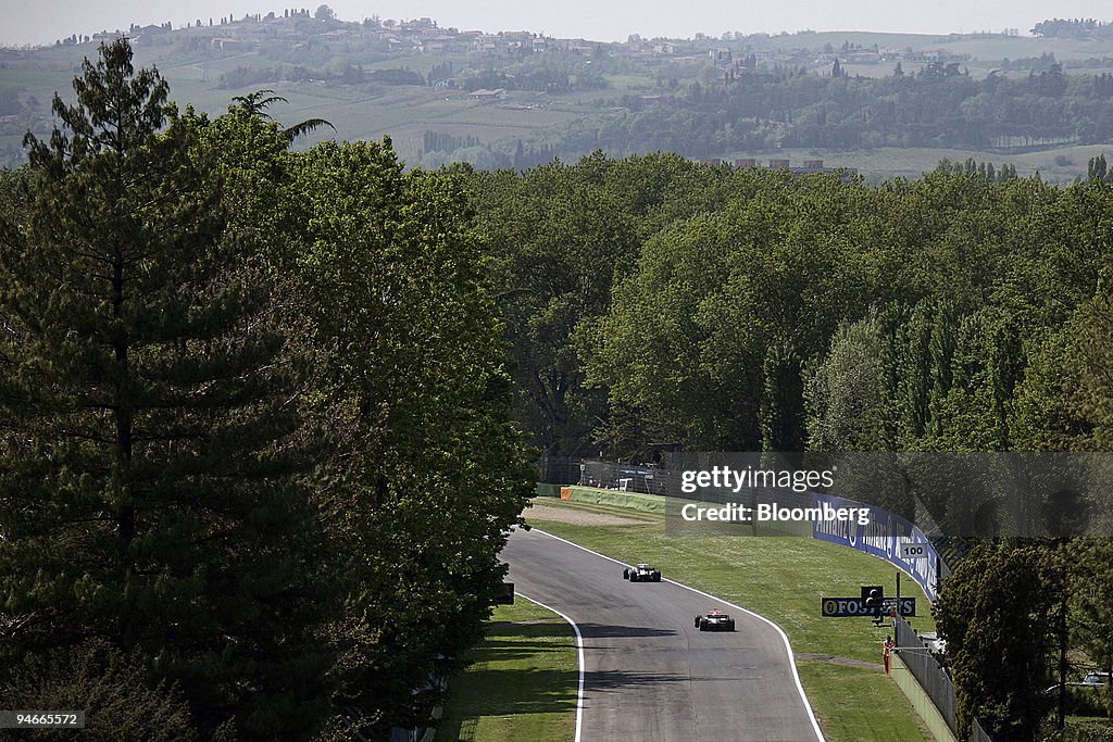 Cars speed around the track during the first practice day fo