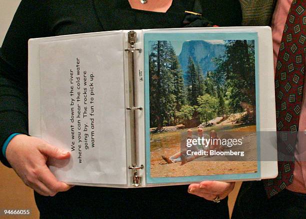 Joanna and Marcus Kerner, the parents of six-year-old Daniel Kerner, pose with a photo from a family outing at Yosemite Park in November 2005 at...