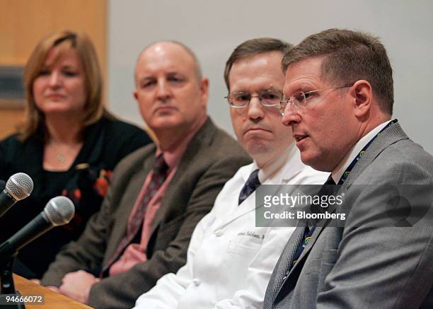 Dr. Robert Steiner, right, answers questions at a news conference with Joanna and Marcus Kerner, left, the parents of six-year-old Daniel Kerner, and...