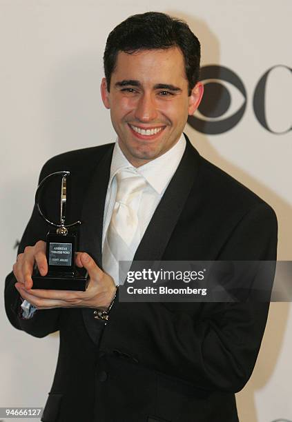Actor John Lloyd Young poses with his award for Best Performance by a Leading Actor in a Musical backstage at the 60th Annual Tony Awards at Radio...
