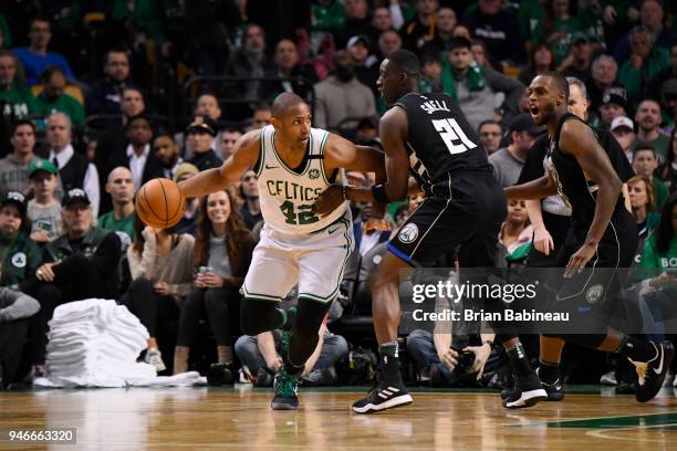 Al Horford of the Boston Celtics handles the ball against Tony Snell of the Milwaukee Bucks in Game One of Round One during the 2018 NBA Playoffs on...