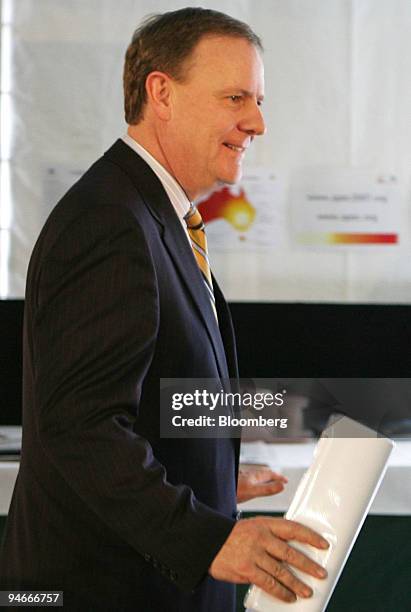 Australian Treasurer Peter Costello leaves the podium after addressing the media at the APEC Finance Ministers Meeting in Coolum, Queensland,...