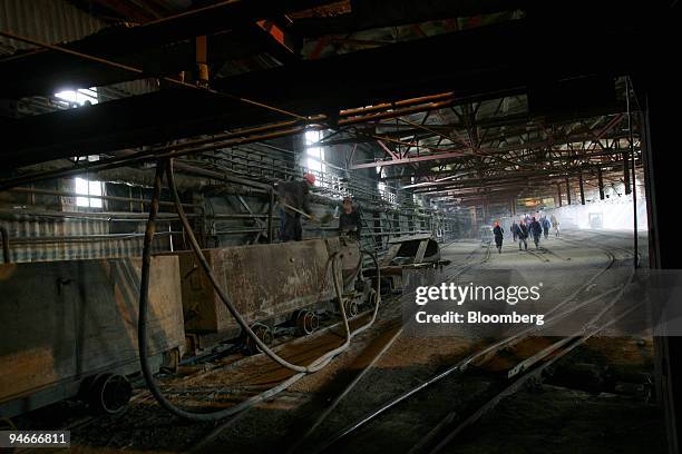 Miners walk toward the entrance of a mine shaft at the Kachkanarsky Vanadium mine, in Nizhny Tagil, Urals, Russia, Friday, July 7, 2006.