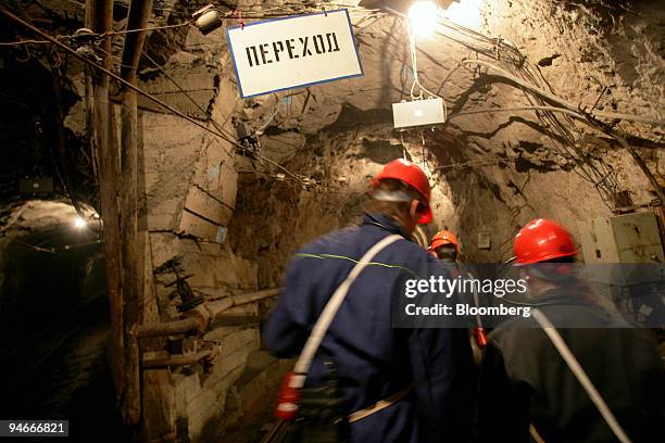 Miners are seen in a tunnel in the Kachkanarsky Vanadium mine, in Nizhny Tagil, Urals, Russia, Friday, July 7, 2006.