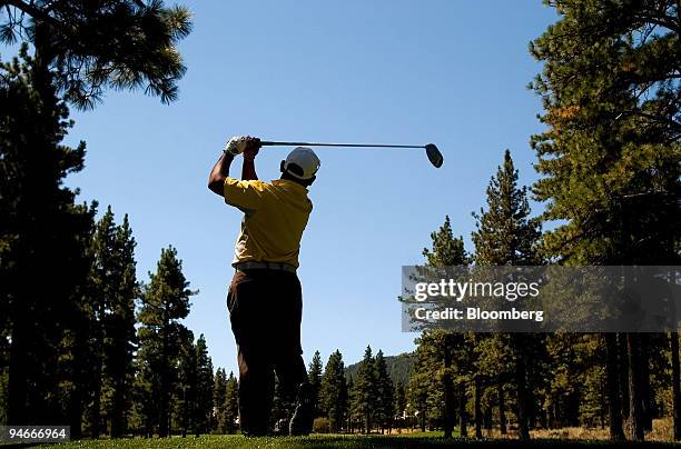 Tadd Fujikawa, a 16-year-old golfer from Hawaii, tees off on the fourth hole during a practice round before the start of the 2007 Reno-Tahoe Open at...