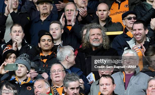 Former Led Zeppelin singer Robert Plant, a fan of Wolverhampton Wanderers celebrates promotion to the Premier League during the Sky Bet Championship...