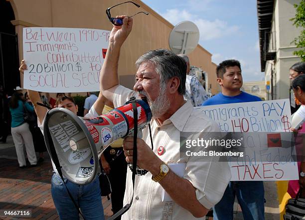 Jaime Martinez, President and Treasurer of the Labor Council of Latin American Advancement of the AFL-CIO , protests outside a House of...