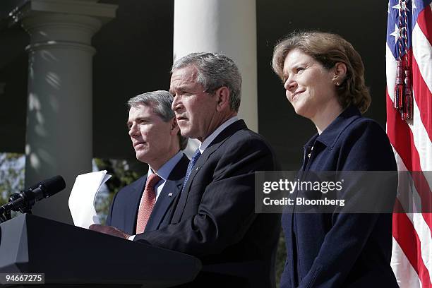 President George W. Bush, center, announces the nomination of US Trade Representative Rob Portman, left, to be the new Director of The White House...