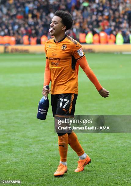 Helder Costa of Wolverhampton Wanderers celebrates promotion to the Premier League after the Sky Bet Championship match between Wolverhampton...