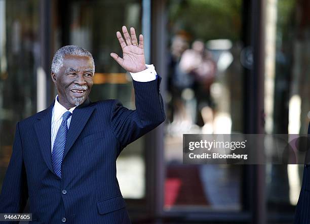 Thabo Mbeki, South Africa?s president, waves to the media during the G20 Finance Ministers and Central Banking Governors meeting in Kleinmond, South...