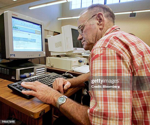 Herschel Noblin, an unemployed heavy equipment operator, uses a computer to search for a job at the East County Career Center in El Cajon,...