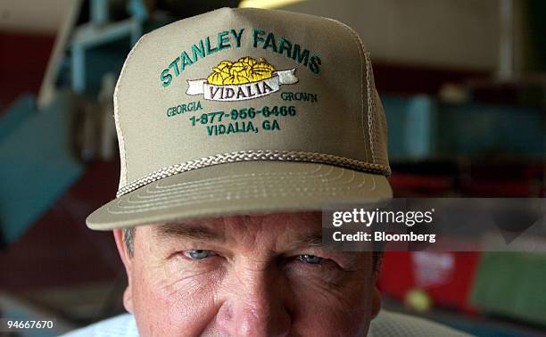 Vidalia onion grower R.T. Stanley stands next to one of his processors in Vidalia, Georgia, Thursday, July 6, 2006. Stanley hired 250 laborers, many...