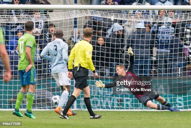 Tim Melia of Sporting Kansas City fails to block the shot on goal by Cristian Roldan of Seattle Sounders during the second half on April 15, 2018 at...