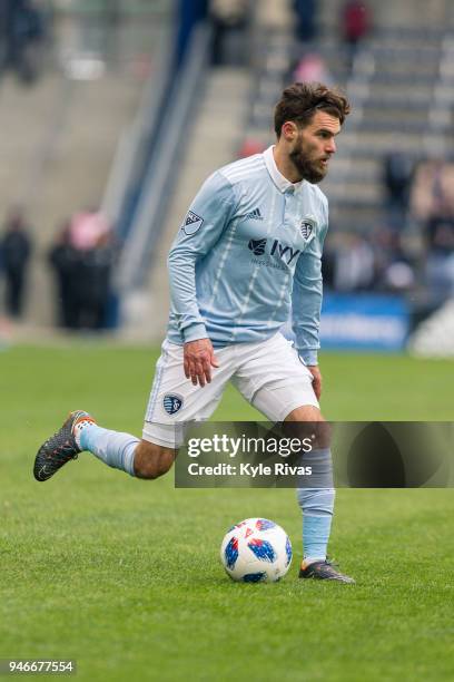 Graham Zusi of Sporting Kansas City pushes the ball up the field against the Seattle Sounders during the second half on April 15, 2018 at Children's...