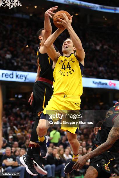 Bojan Bogdanovic of the Indiana Pacers drives to the basket past Larry Nance Jr. #22 of the Cleveland Cavaliers during the first half in Game One of...