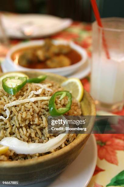 Meals lay on a table at Islamabad Club restaurant in Hong Kong, China, Thursday, July 5, 2006. "Let me tell you a secret," said Ripon Mohammed, eyes...