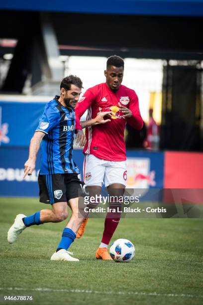 Ignacio Piatti of Montreal Impact tries to get past Michael Murillo of New York Red Bulls during the Major League Soccer match between Montreal...
