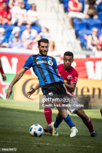 Ignacio Piatti of Montreal Impact tries to get past Red Bulls player during the Major League Soccer match between Montreal Impact and New York Red...