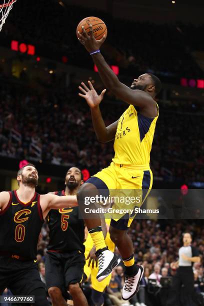 Lance Stephenson of the Indiana Pacers gets to the basket next to Kevin Love of the Cleveland Cavaliers during the first half in Game One of the...