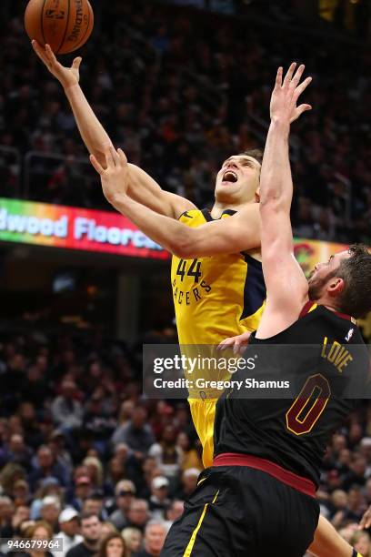 Bojan Bogdanovic of the Indiana Pacers drives to the basket past Kevin Love of the Cleveland Cavaliers in Game One of the Eastern Conference...