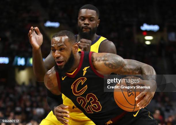 LeBron James of the Cleveland Cavaliers drives past Lance Stephenson of the Indiana Pacers during the second half in Game One of the Eastern...