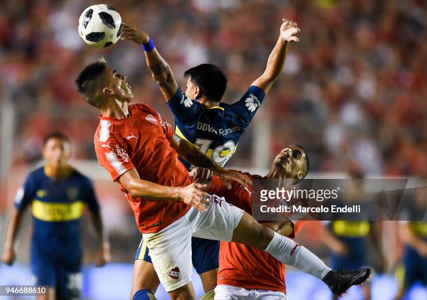 Leandro Fernandez of Independiente fights for the ball with Walter Bou of Boca Juniors during a match between Independiente and Boca Juniors as part...