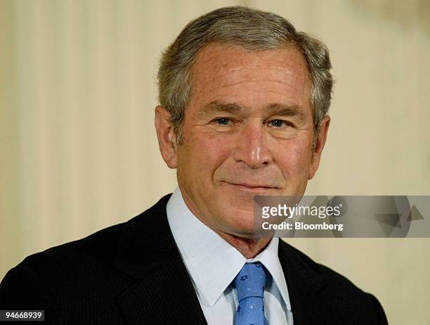 President George W. Bush smiles during a ceremony for recipients of the National Medals of Arts and Humanities at the White House in Washington,...