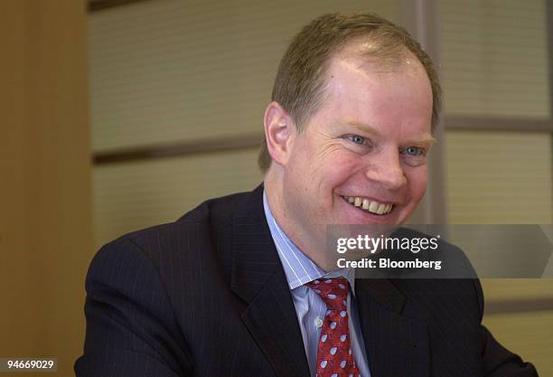 Walter Borst, treasurer of General Motors Corp., smiles during an interview at the General Motors Building in New York on Tuesday, April 11, 2006.