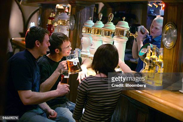 Pub visitors enjoy a lager in pub in Moscow, Russia, Tuesday, April 11, 2006. Scottish & Newcastle Plc, the U.K.'s largest brewer, agreed to buy the...