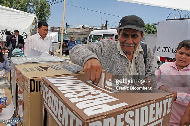 Man casts his ballot in the Mexican elections in Chimalhuacan county, Mexico on Sunday, July 2, 2006. Mexicans voted in an election that serves as a...