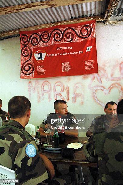 Soldiers from the United Nations Interim Force in Lebanon sit in the back garden of the Ali Shelter restaurant across the road from their main base...