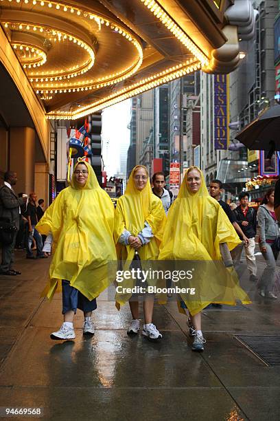 Eileen Moore, Anita Butcher, and Marg Dolores from Ohio and Tennessee walk through Times Square in New York, on Monday, July 23, 2007.