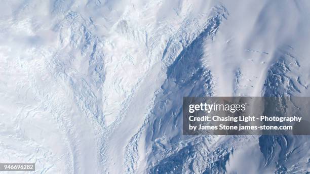 aerial image of several glaciers meeting in antarctica - antartica stock-fotos und bilder