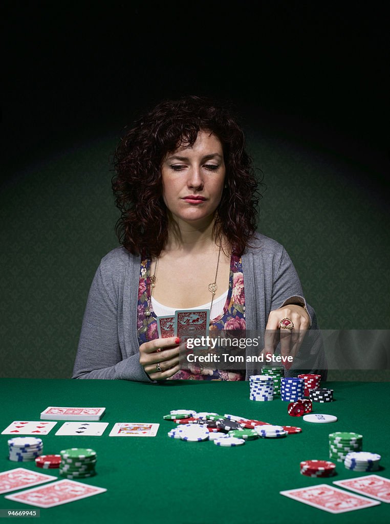 Young woman playing Texas Hold'em poker.