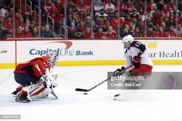 Cam Atkinson of the Columbus Blue Jackets scores a goal on Philipp Grubauer of the Washington Capitals in the first period during Game Two of the...